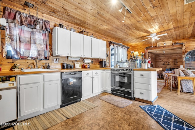 790 Farmingdale Rd, Jackson, NJ 08527 - kitchen featuring black appliances, white cabinets, wood walls, wooden ceiling, and track lighting