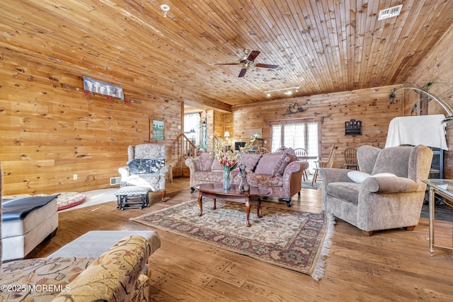 790 Farmingdale Rd, Jackson, NJ 08527 - living room with wooden walls, a ceiling fan, and hardwood / wood-style floors