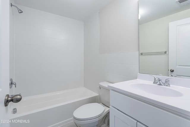 full bathroom with shower / bathing tub combination, vanity, toilet, and tile walls