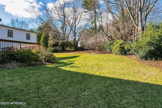 view of yard with a deck