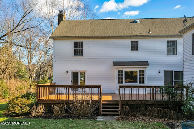 back of property with a deck