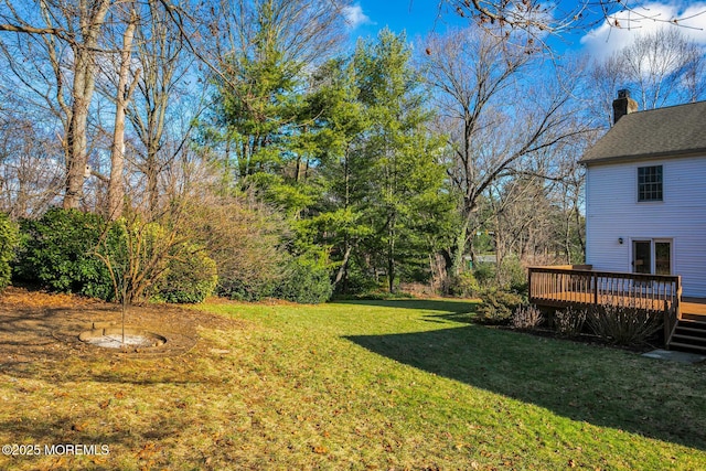 view of yard with a wooden deck