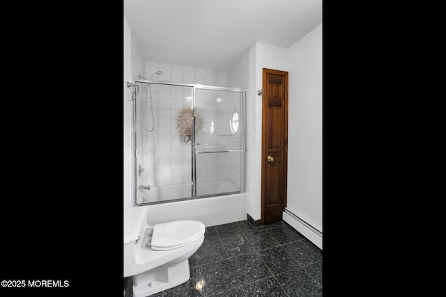 bathroom with baseboard heating, bath / shower combo with glass door, and toilet