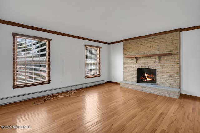 unfurnished living room with hardwood / wood-style flooring, crown molding, a fireplace, and a baseboard heating unit