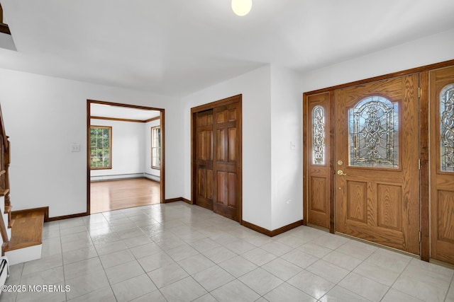 tiled entrance foyer with a baseboard radiator