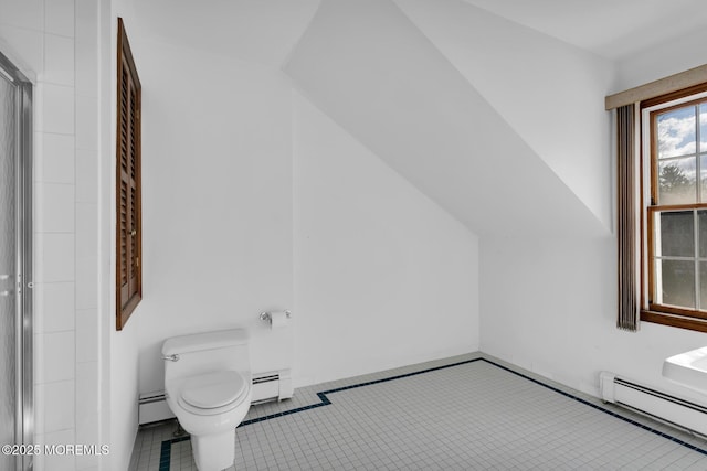 bathroom with tile patterned flooring, toilet, and baseboard heating