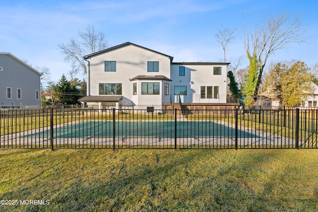 view of swimming pool with a lawn and a patio area