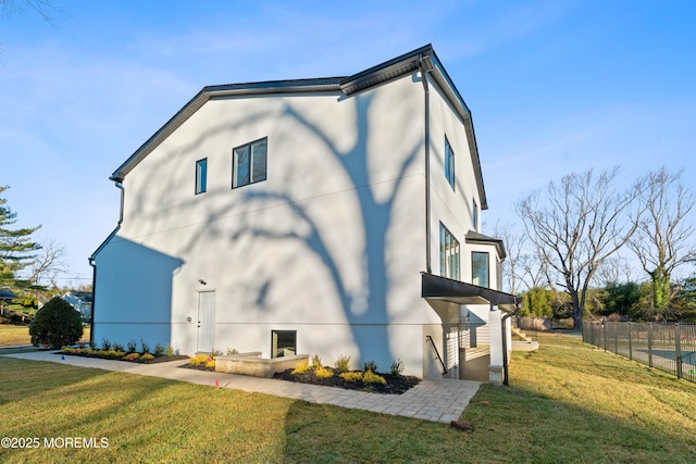 view of home's exterior with a yard