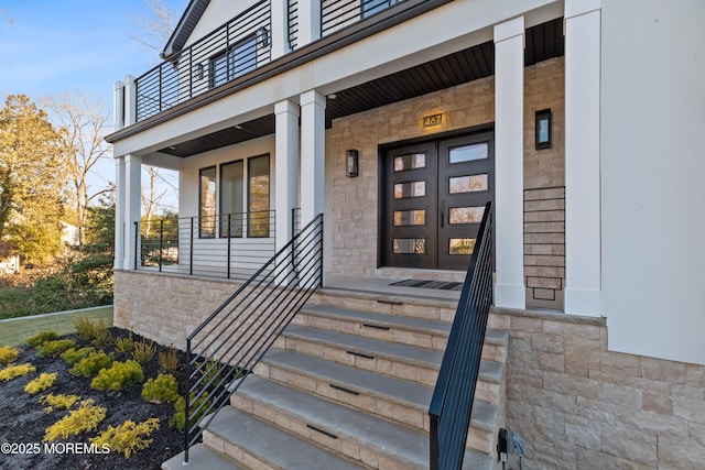 view of exterior entry with a porch