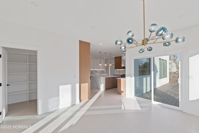 interior space with decorative backsplash, decorative light fixtures, and a notable chandelier