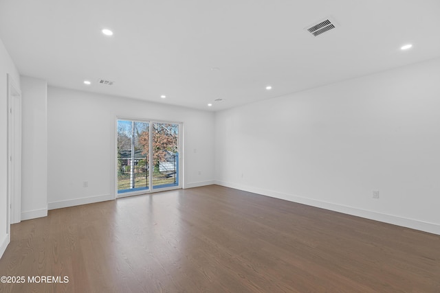 empty room featuring wood-type flooring