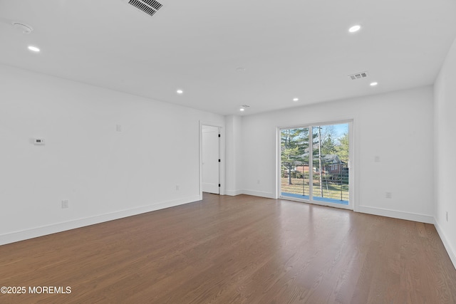 empty room with wood-type flooring