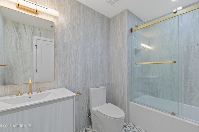 full bathroom with vanity, combined bath / shower with glass door, and toilet