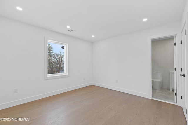 unfurnished room featuring light hardwood / wood-style flooring