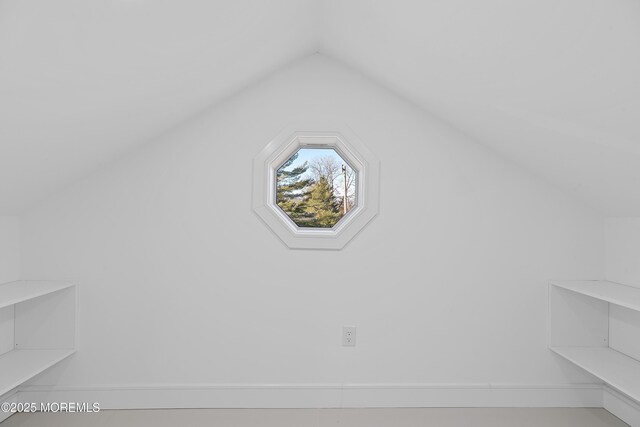 bonus room with vaulted ceiling