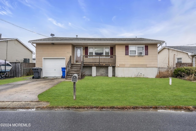 single story home featuring a garage and a front yard