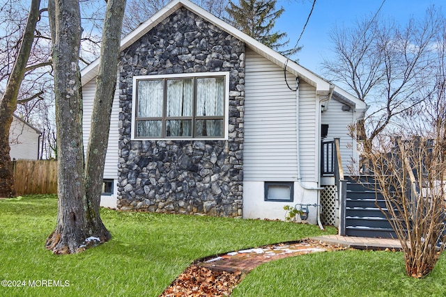 view of property exterior featuring a yard