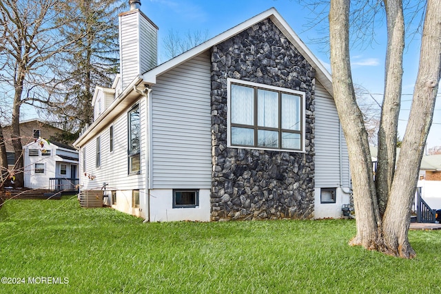 view of side of home featuring a yard