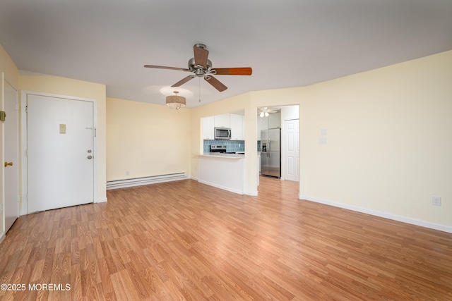 unfurnished living room with ceiling fan, baseboard heating, and light hardwood / wood-style floors