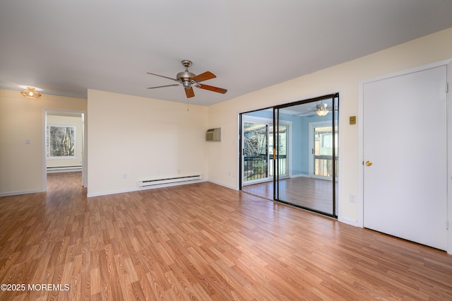 spare room featuring a wall mounted air conditioner, a baseboard radiator, light hardwood / wood-style floors, and ceiling fan