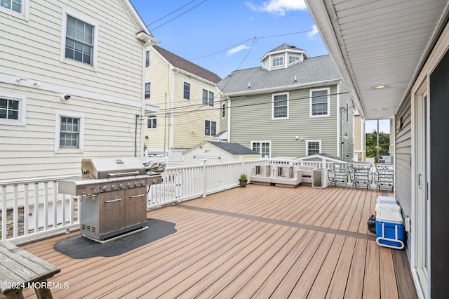 wooden terrace with a grill