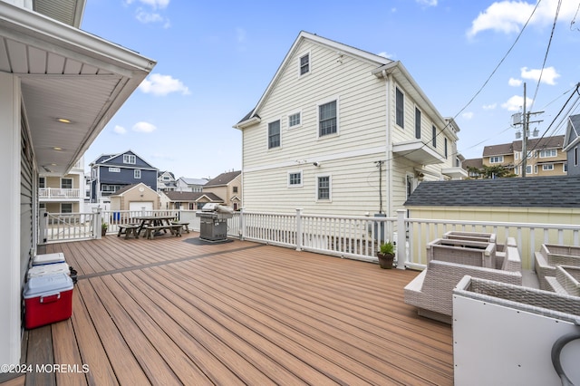 wooden deck with grilling area