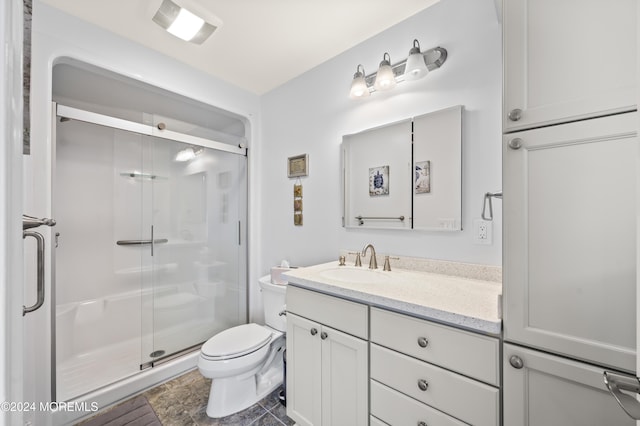 bathroom with vanity, toilet, and walk in shower