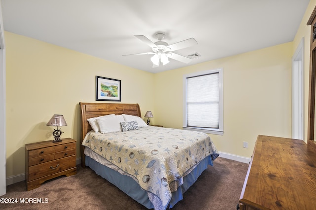 bedroom featuring ceiling fan and dark colored carpet