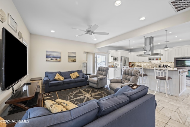 living room featuring ceiling fan