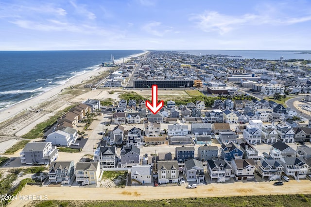 drone / aerial view with a view of the beach and a water view