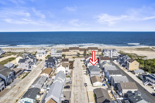 aerial view with a view of the beach and a water view