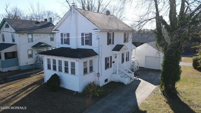 view of front of property featuring an outbuilding and a garage