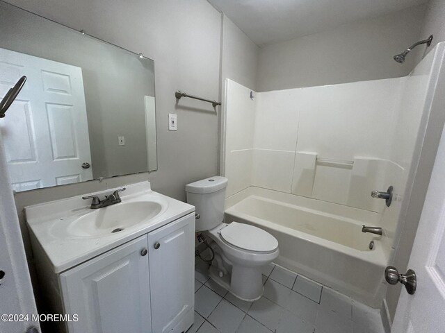 full bathroom with tile patterned flooring, vanity, shower / bath combination, and toilet