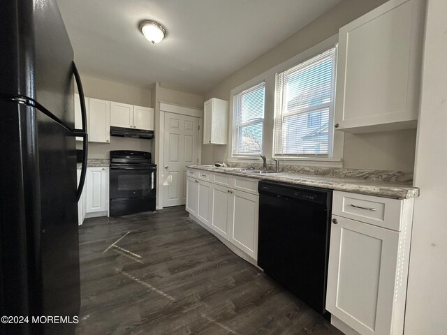 kitchen featuring dark hardwood / wood-style flooring, sink, white cabinetry, and black appliances