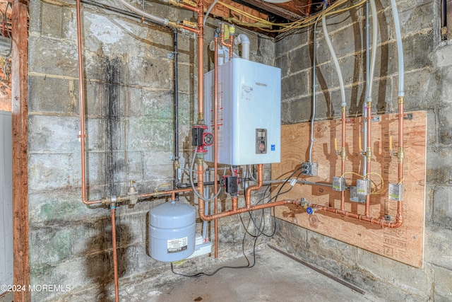 utility room with tankless water heater