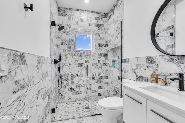 bathroom with toilet, vanity, tile walls, and walk in shower