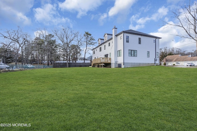 exterior space with a yard and a wooden deck