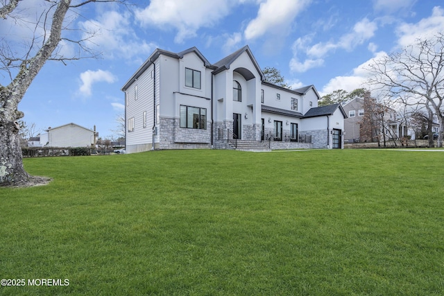 rear view of property with a lawn