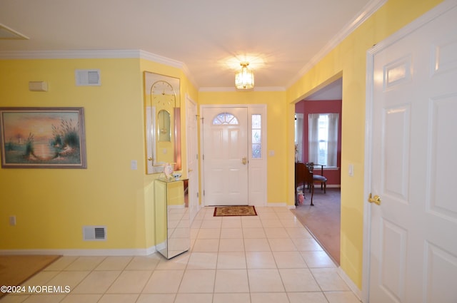 entryway featuring light tile patterned floors and ornamental molding