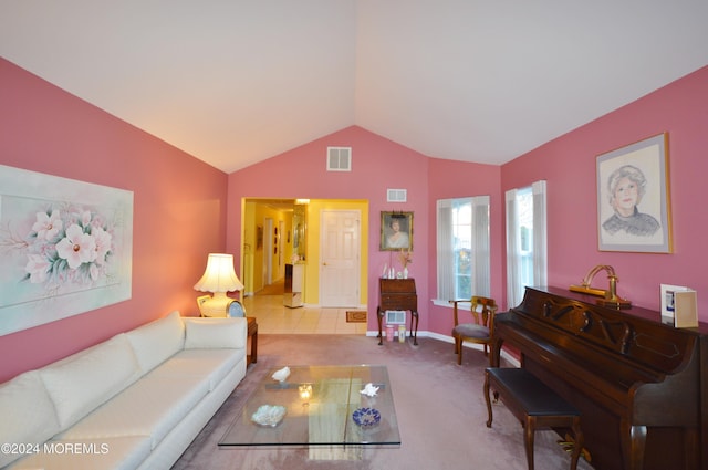 carpeted living room featuring lofted ceiling