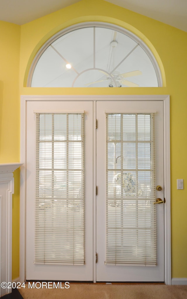 entryway featuring carpet floors and french doors