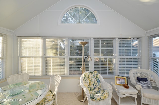 sunroom / solarium with a wealth of natural light and vaulted ceiling