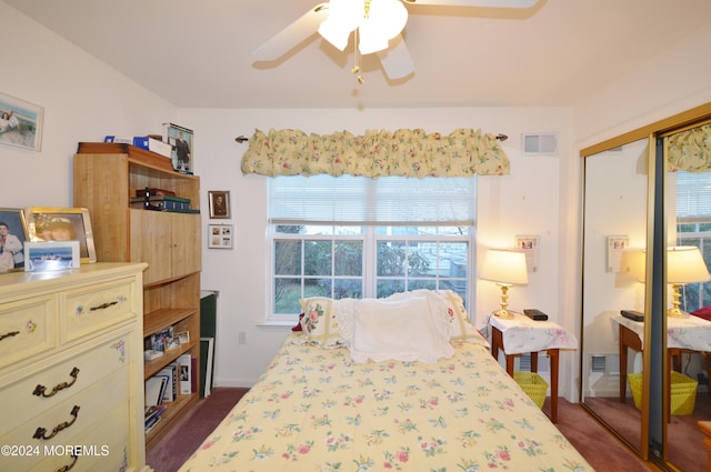 carpeted bedroom featuring a closet and ceiling fan