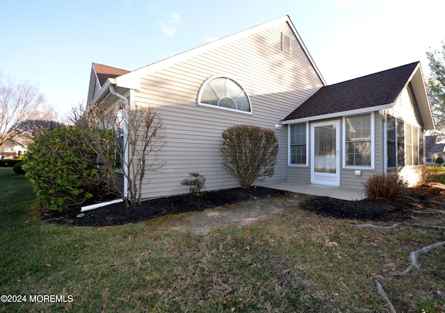 view of home's exterior featuring a lawn