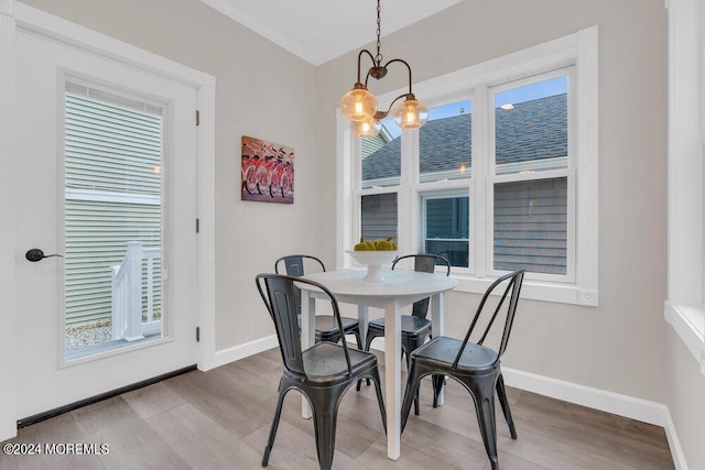 dining room featuring hardwood / wood-style flooring and a chandelier