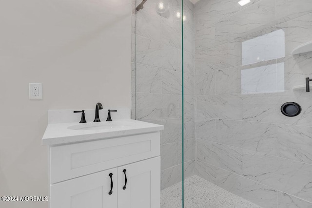 bathroom featuring vanity and a tile shower