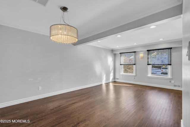 unfurnished room with ornamental molding, dark wood-type flooring, and a notable chandelier