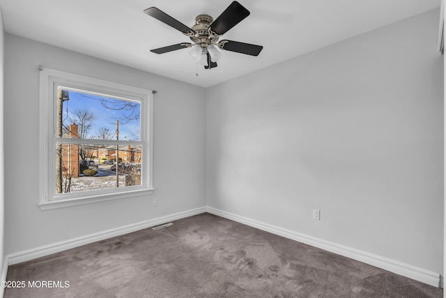 carpeted empty room with ceiling fan