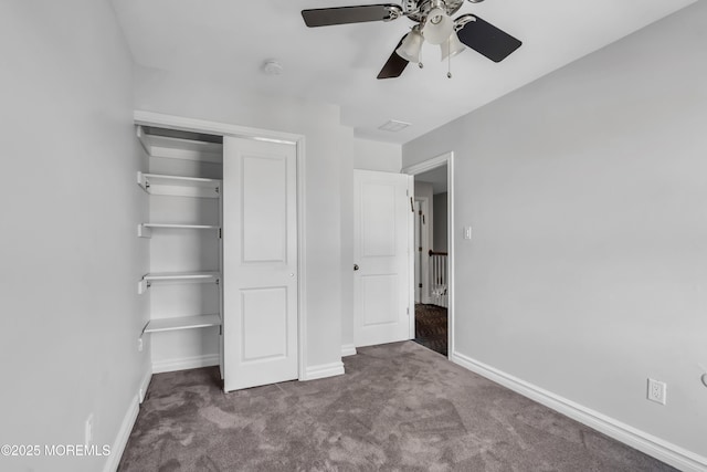 unfurnished bedroom featuring ceiling fan, carpet floors, and a closet