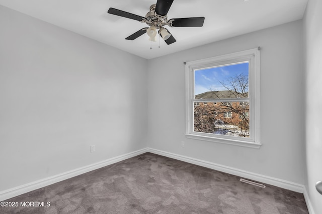 unfurnished room with carpet flooring and ceiling fan